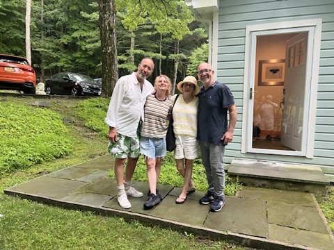 Family photo near a Cape Cod house