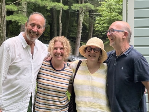 Mitch and family smiling outdoors