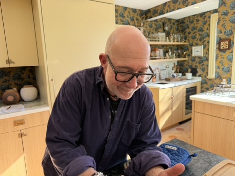 Mitch looking down in the kitchen