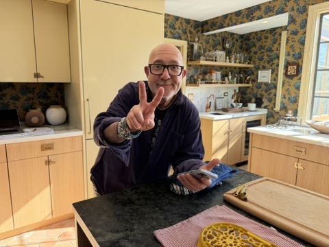 Mitch talking in a kitchen